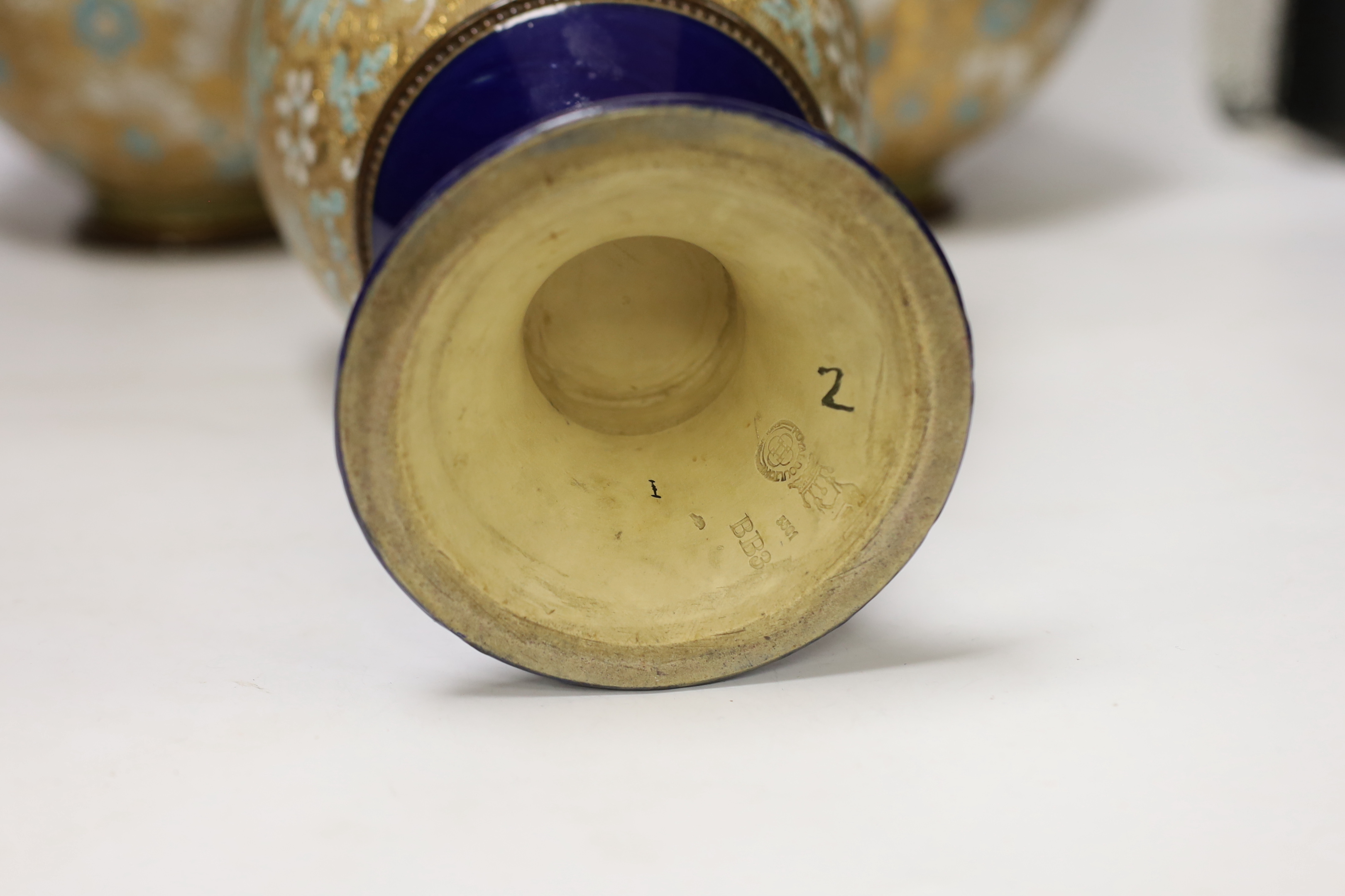 A pair of Royal Doulton Lambeth Slaters patent bottle vases and another similar vase, 41cm